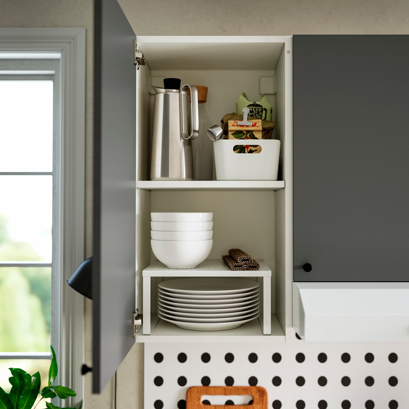 A dark grey KNOXHULT wall cabinet with door