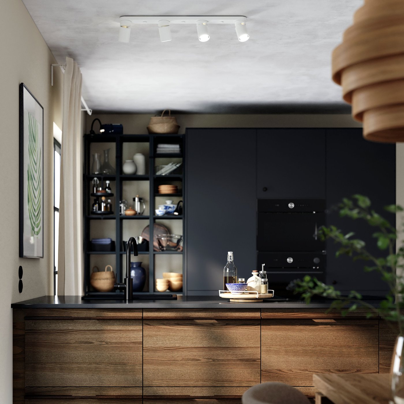 A black stone effect/quartz KASKER custom made worktop in the kitchen