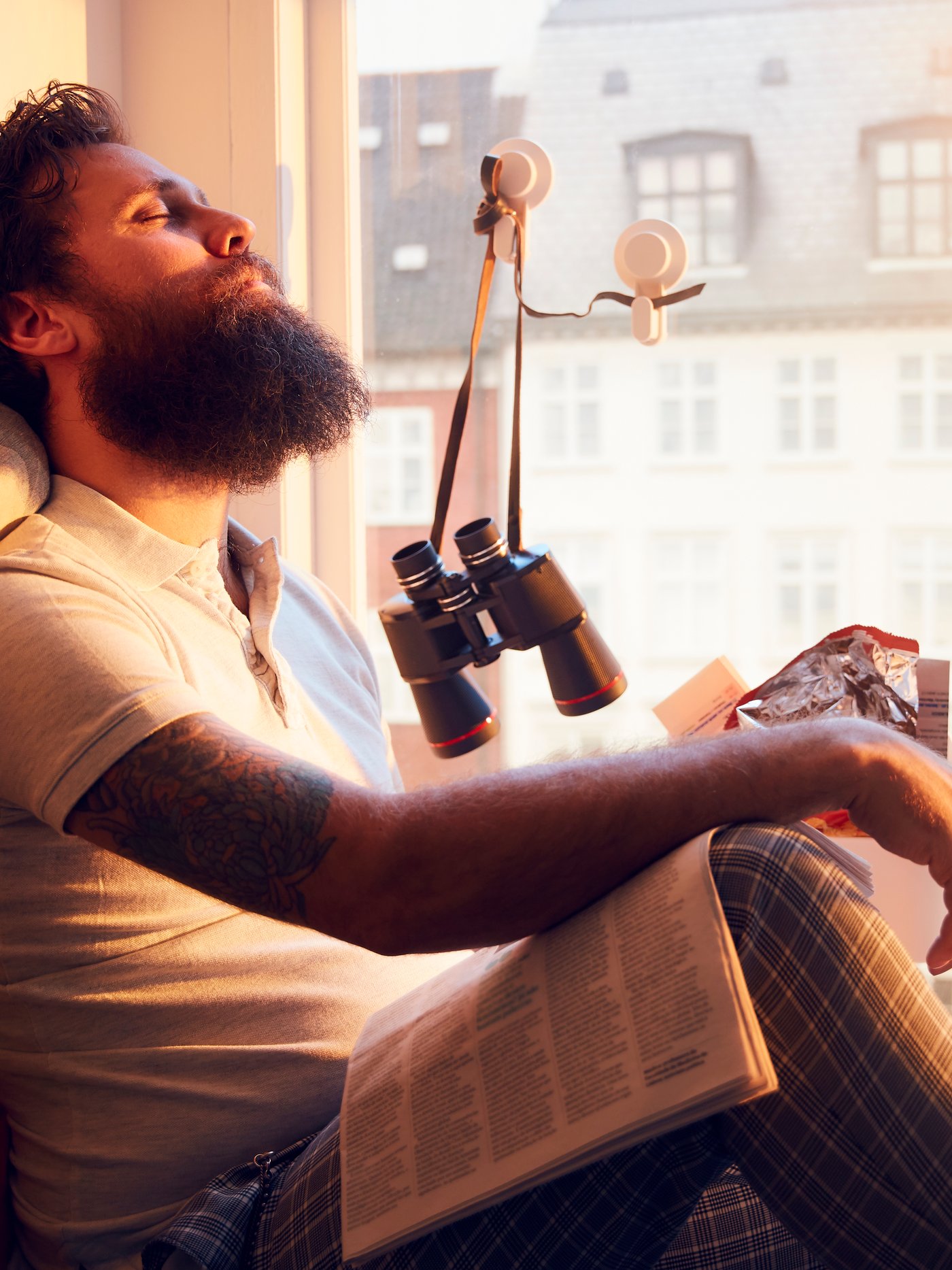 A white TISKEN hook with suction cup in the living room