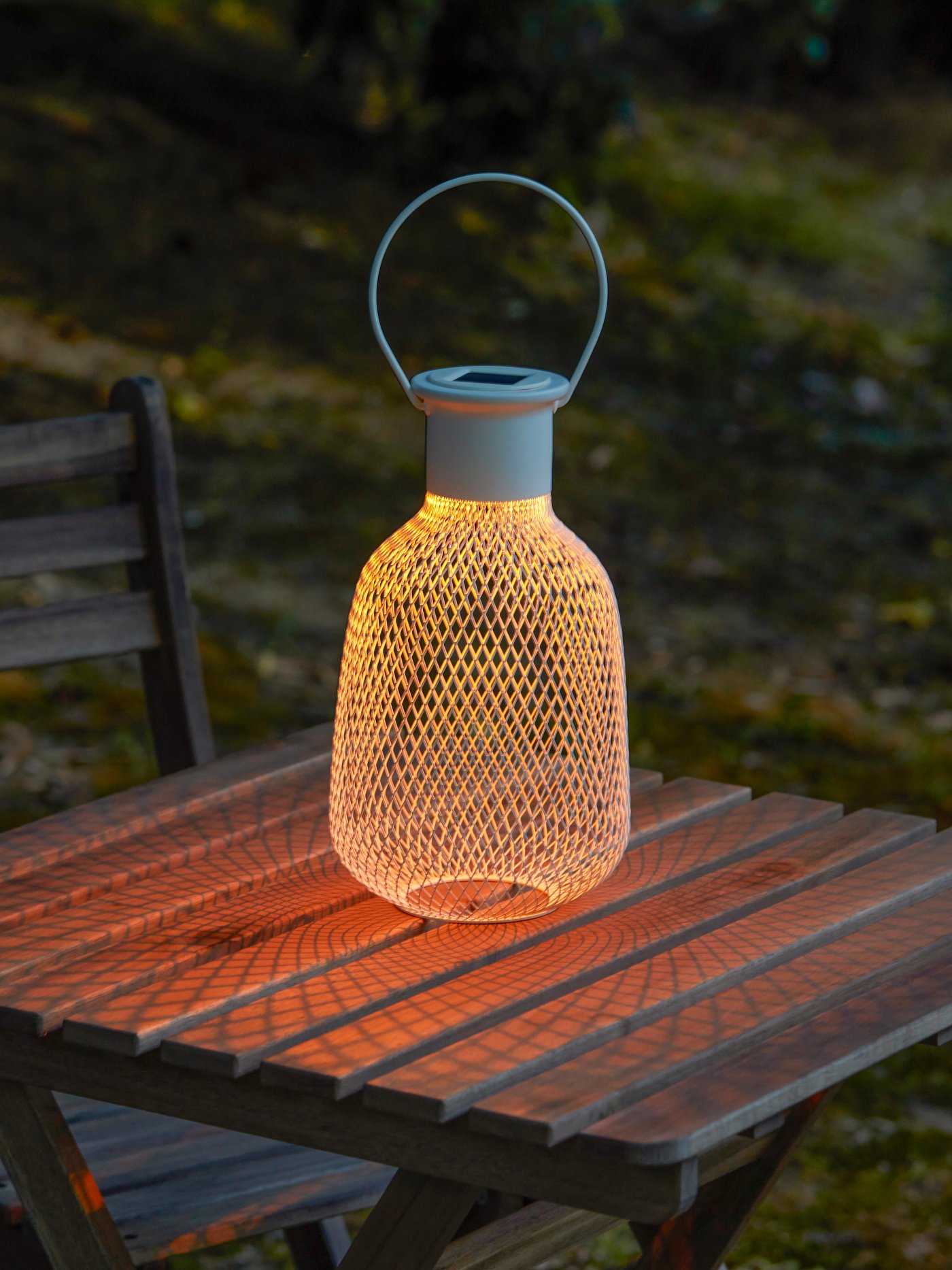 An outdoor/mesh white SOLVINDEN LED solar-powered lantern