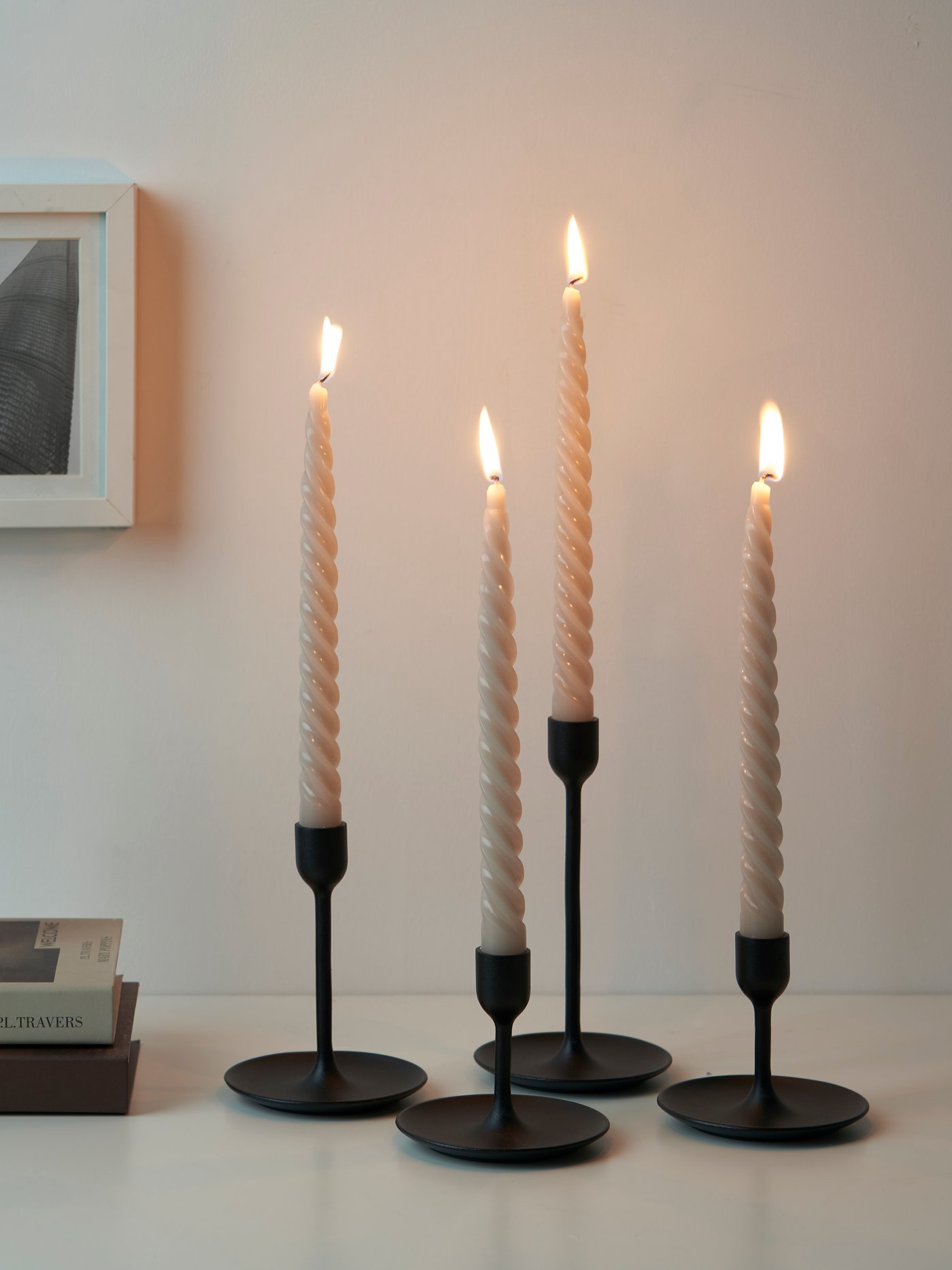 A twisted/dark grey-beige CONTORTATALL unscented chandelier candle