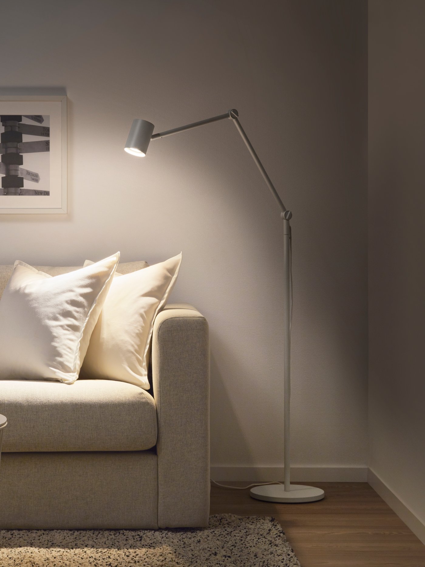 A white NYMÅNE floor/reading lamp