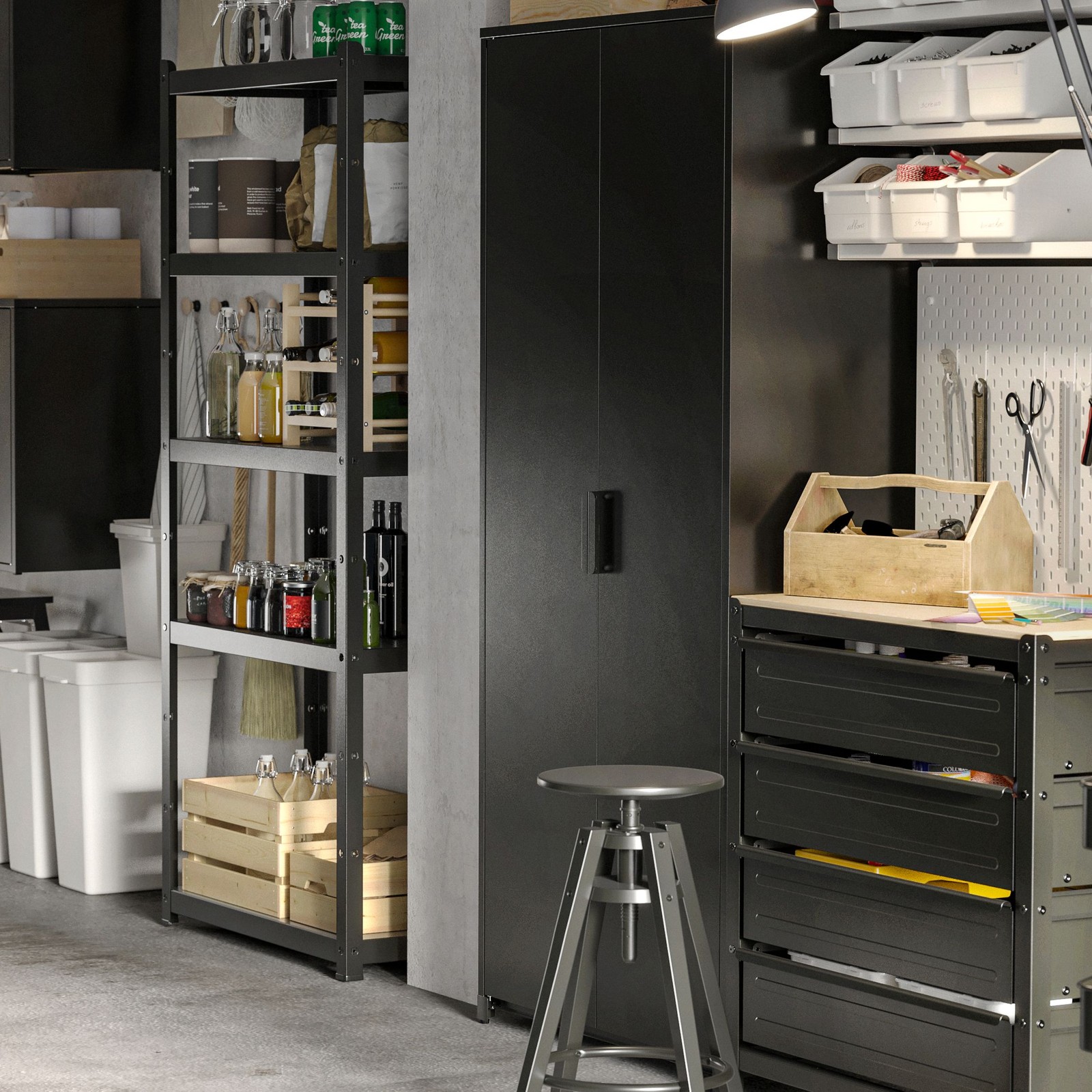 In a garage are black open and closed storage cabinets. On the shelves are boxes and bottles. Underneath are recycling bins.