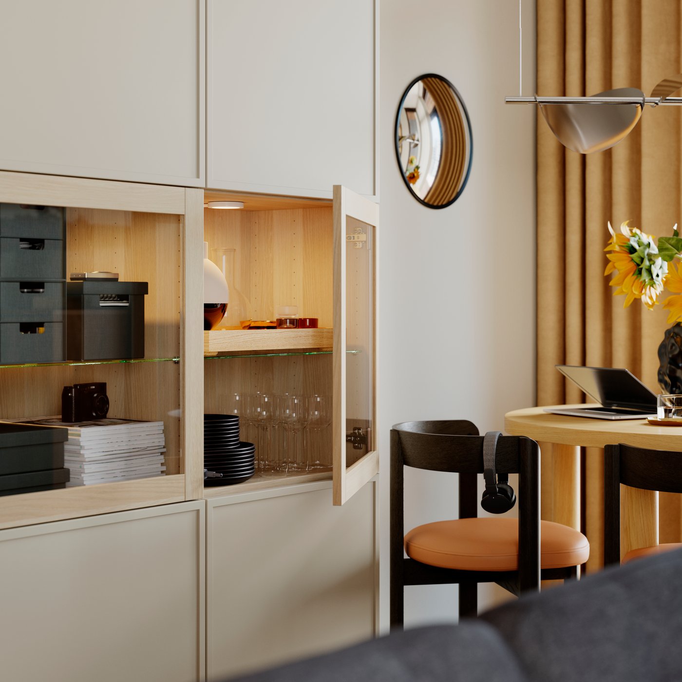 FJÄDERHARV mini chests with 2 drawers and other things inside a BESTÅ storage combination with doors with one door open.