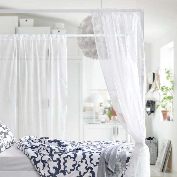 A white/Luröy VITARNA four-poster bed frame