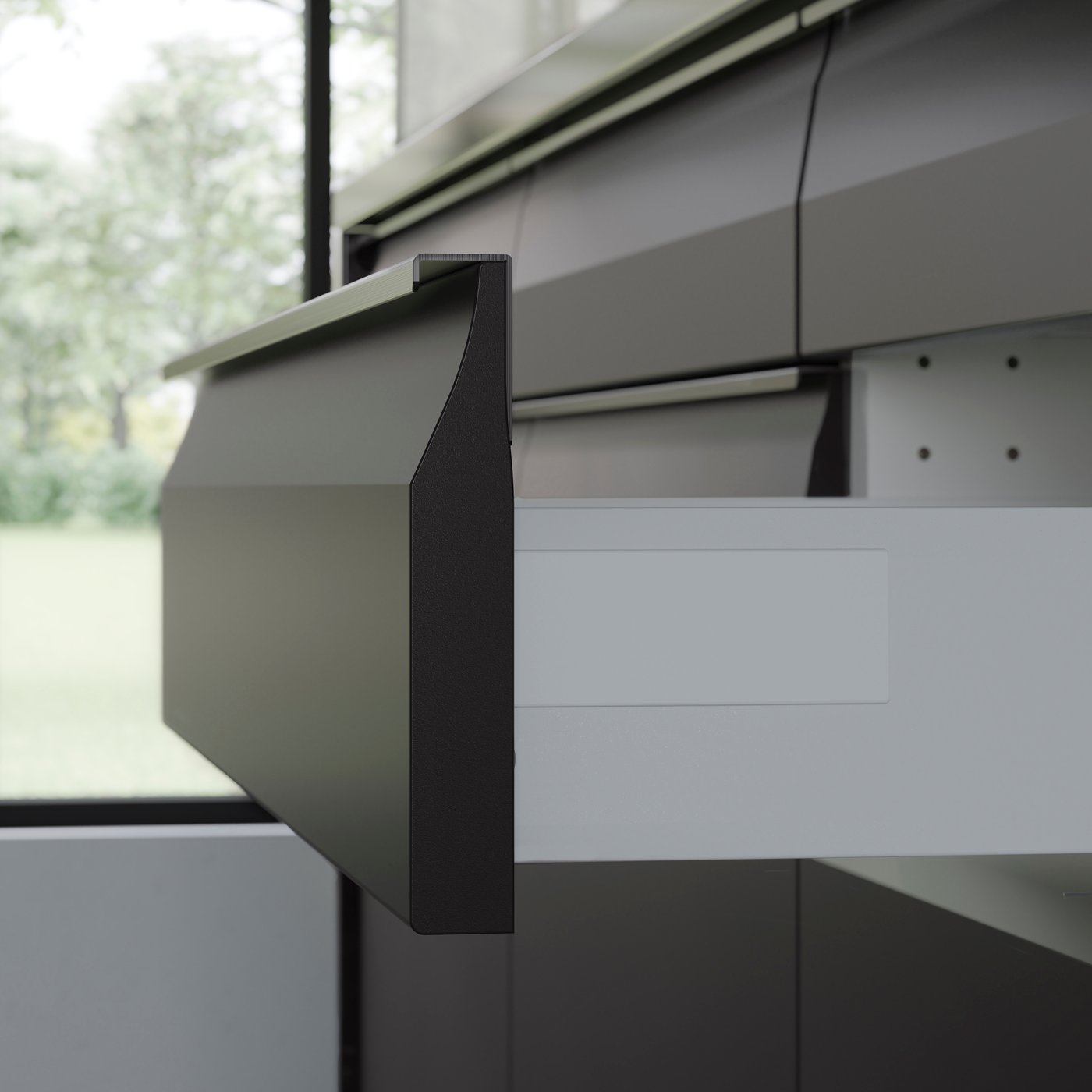 An open drawer of a matt anthracite UPPLÖV kitchen.