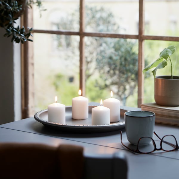 A grey BLODOLVON candle dish