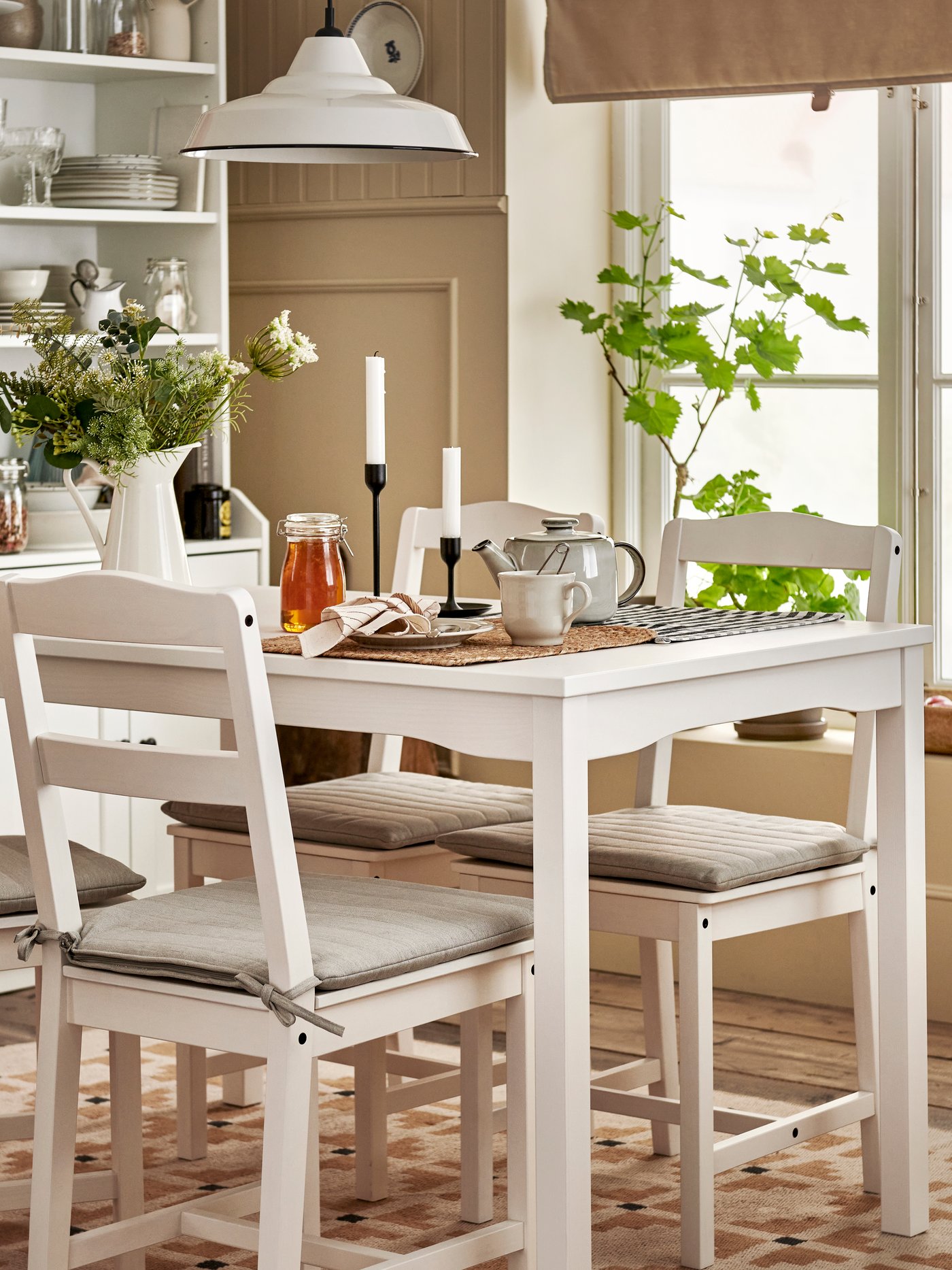 A white/white HAUGA table and 4 chairs