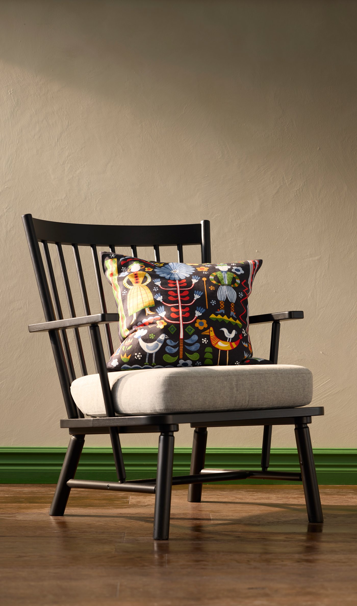 A black/Tibbleby beige/grey PERSBOL armchair