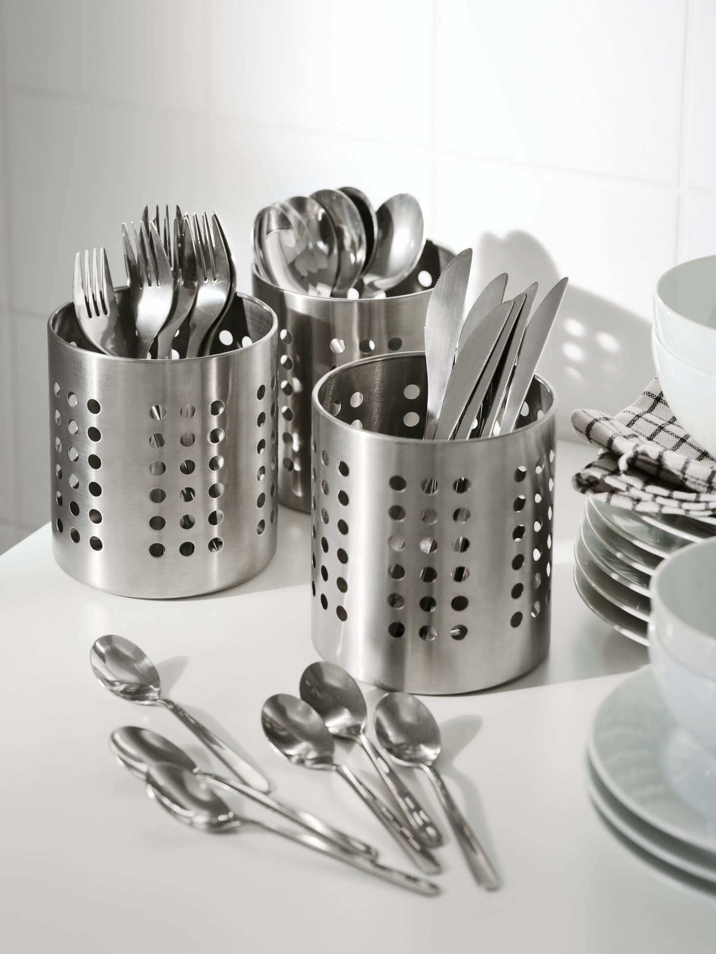 A stainless steel ORDNING cutlery stand in the kitchen