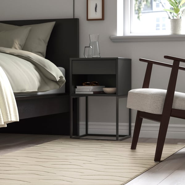 An off-white VÄXELFEL rug, low pile