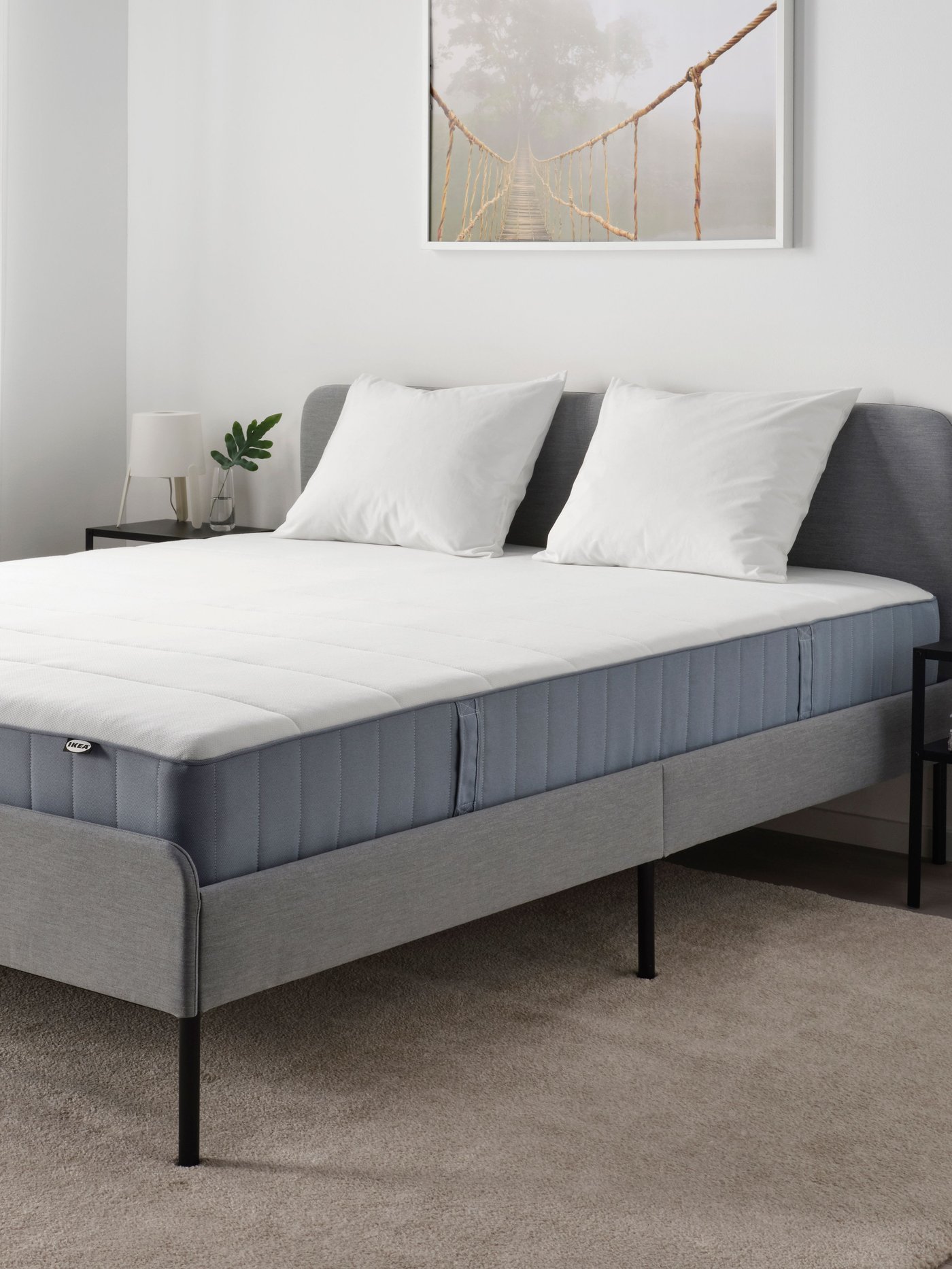 An extra firm/light blue VESTERÖY pocket sprung mattress