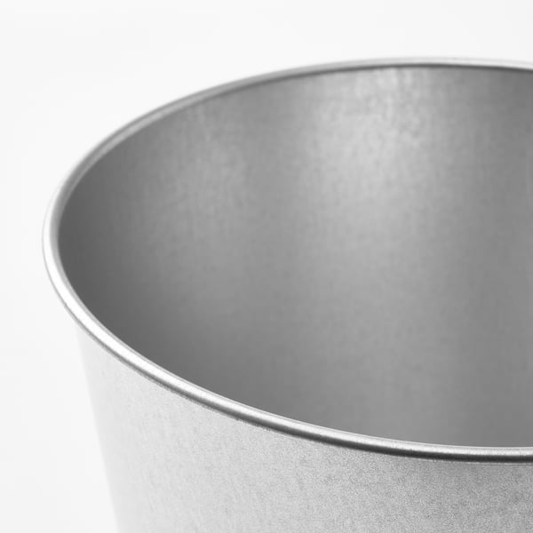 Silver metallic planter, seamlessly designed, smooth surface, captures light, clean edge.
