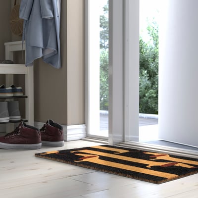 ARBETSTÅG doormat with striped coir pattern at doorway.