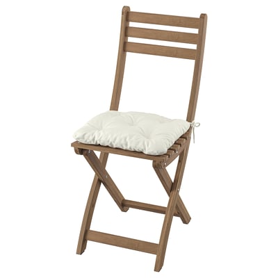 Wooden brown folding chair with white cushion, rustic design.
