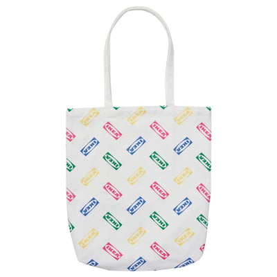 White tote bag with colourful IKEA logos, cotton material, rectangular shape, long handles.