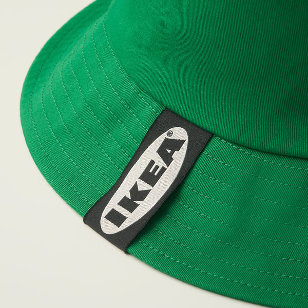 Bright green baseball cap with black and white ikea logo on side. Well-stitched, seems durable.
