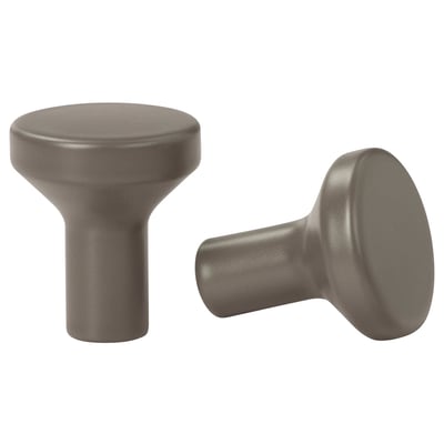 Two smooth, gray, cylindrical cabinet knobs with rounded tops, set against a white background.