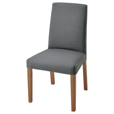 A BERGMUND chair with grey fabric and wooden legs, offering a sleek design and comfortable seating.