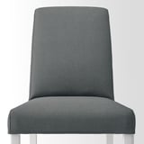Gray patterned upholstered chair with wooden legs.