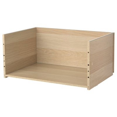 A BESTÅ drawer frame in light oak colour, made of particleboard and plastic foil, with a rectangular shape and simple design.