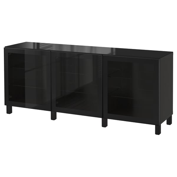 Black BESTÅ cabinet with glass doors and black legs.