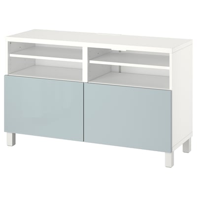 White BESTÅ tv stand with adjustable shelves and light blue doors.