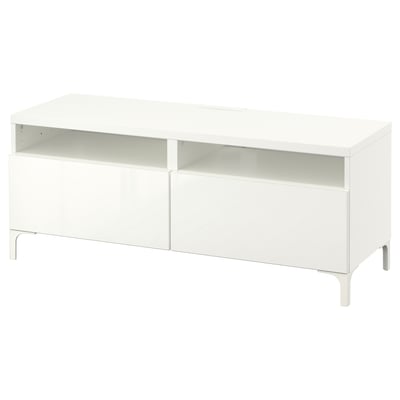 White BESTÅ tv stand, modern design with open section and two drawers, made of particleboard and steel.