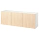 A white and light wooden BESTÅ wall-mounted cabinet with four doors.