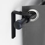 Black curtain rod holder mounted on wall, part of BETYDLIG system, adjustable for various curtain setups.