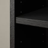 Close-up of BILLY bookcases dark wooden shelf, showcasing its textured finish and sturdy construction.
