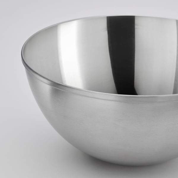 Stainless steel bowl, sleek design, polished surface, reflective interior; simple yet durable.