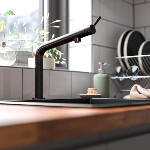 Black BOSJÖN kitchen faucet with smooth curves and sleek, stainless steel finish stands out in kitchenware.
