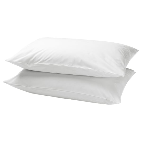 Two white, rectangular pillows stacked neatly, made of soft cotton, smooth and simple design.
