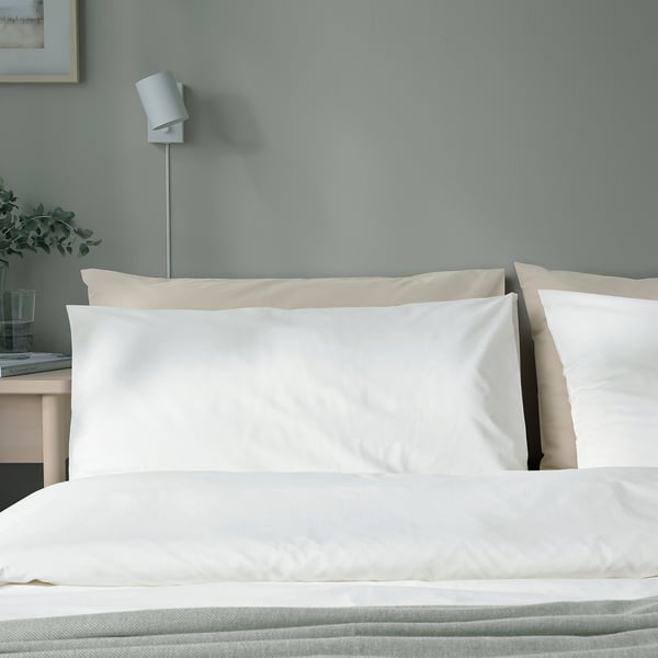 DVALA white pillowcases shown on bed, large, with natural cotton, minimalist design.