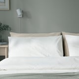 DVALA white pillowcases shown on bed, large, with natural cotton, minimalist design.