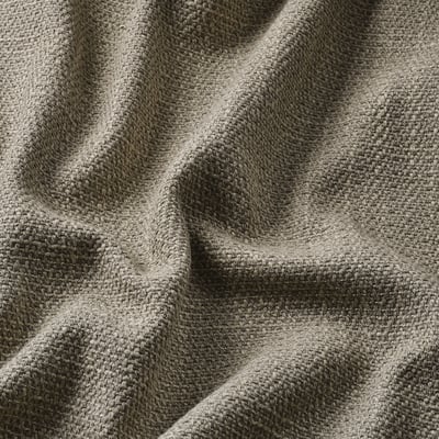Close-up of fabric with textured, irregular yarns; soft and supportive.