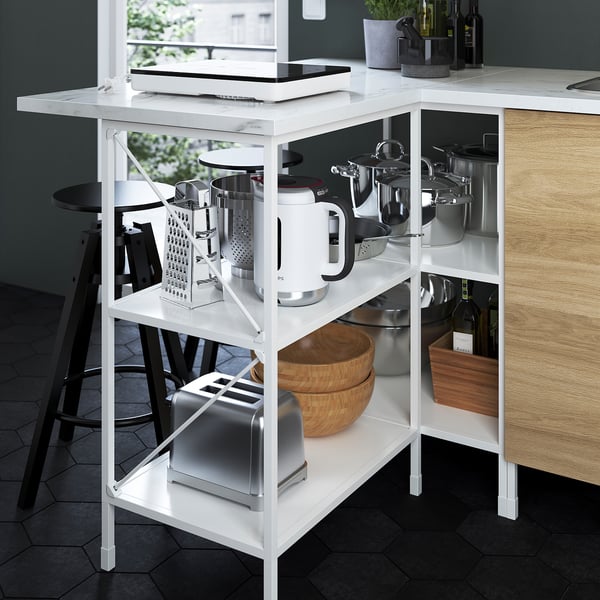 Modern white kitchen shelf organizer with multiple appliances, including a toaster, mixer, and pots.