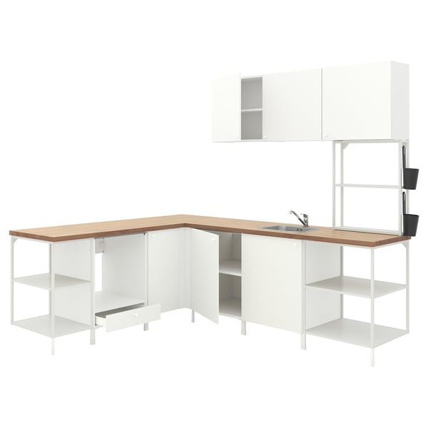 Modern white kitchen unit with light wood counter, featuring open shelves, cabinets, and a sink.