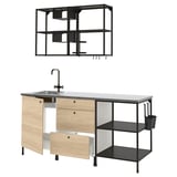 Modern kitchen setup: light wood & black metal units, sink, shelves, & lights.