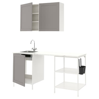 Modern kitchen set with grey & white cabinets, sink, and open shelves.