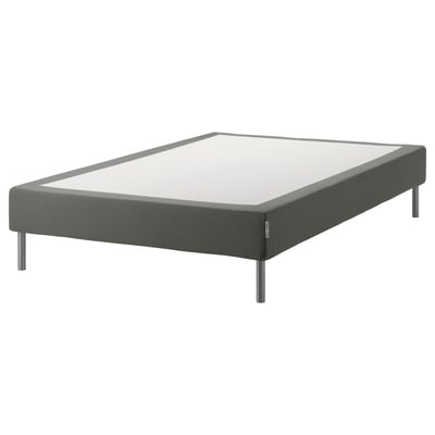 Gray upholstered bed base with metal legs. Its a modern, low-profile frame designed for comfort and support.