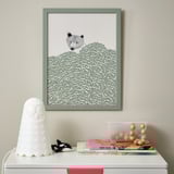 Stylized bear art, owl lamp, whale figurine, books, and container on drawer