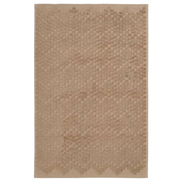 Beige FJÄLLKATTFOT bath mat, cotton, rectangular, textured.