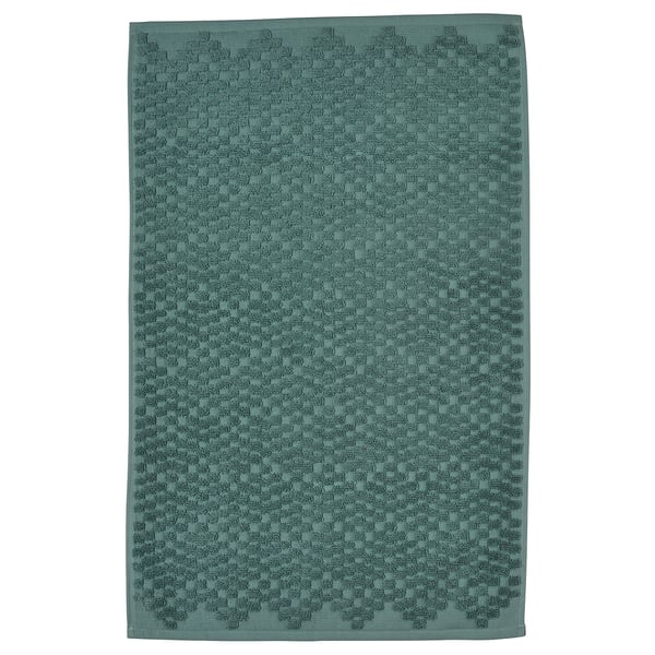 A FJÄLLKATTFOT bath mat in turquoise. Rectangular, textured with a cotton weave.