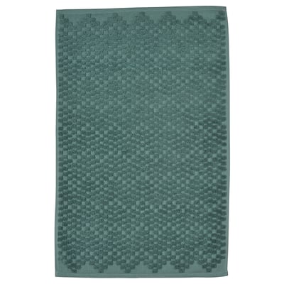 A FJÄLLKATTFOT bath mat in turquoise. Rectangular, textured with a cotton weave.