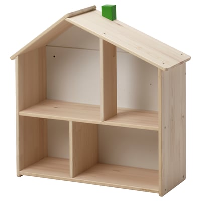 Wooden light-colored house-shaped shelf with single green block on top.
