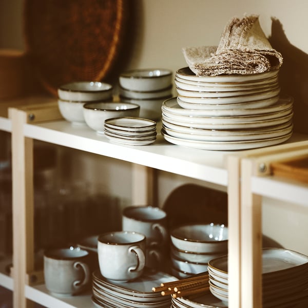 GLADELIG dishware set: white, sand-glazed, stackable stoneware with classic shapes.