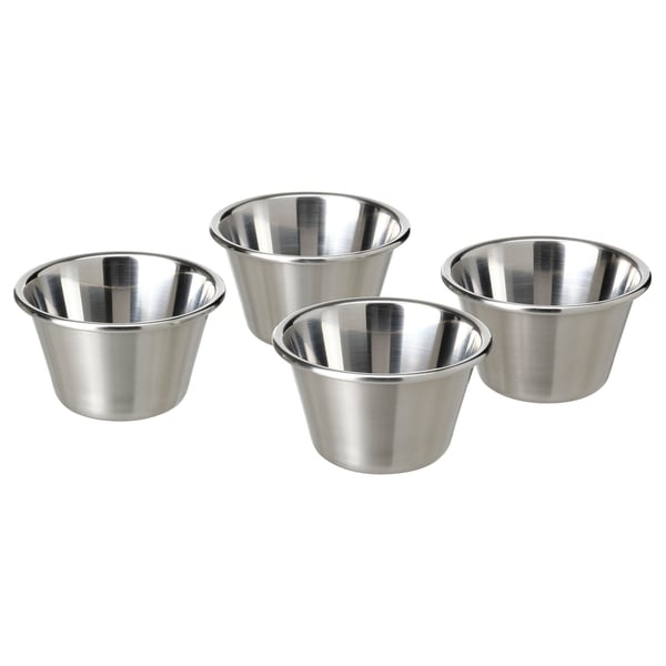 Four shiny, silver metallic, stainless steel bowls arranged in a square formation, each with a wide, round shape and smooth edges.