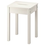 A white, square-topped, solid pine HAUGA stool with a cut-out handle, suitable for extra seating or as a side table.